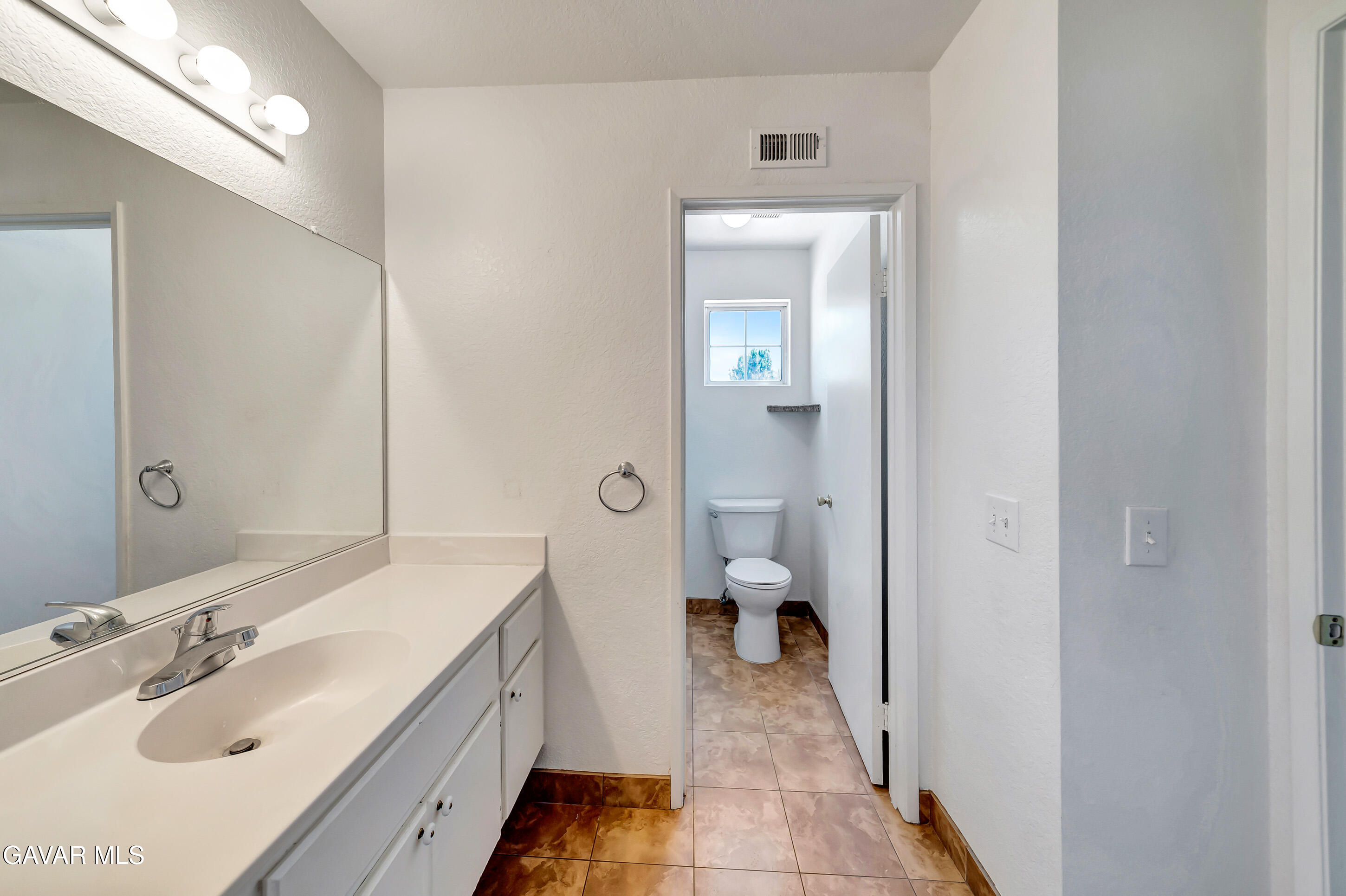 3115 Crowne Drive Palmdale, CA 93551 - Photo 48 of 51 a bathroom with a sink toilet and shower