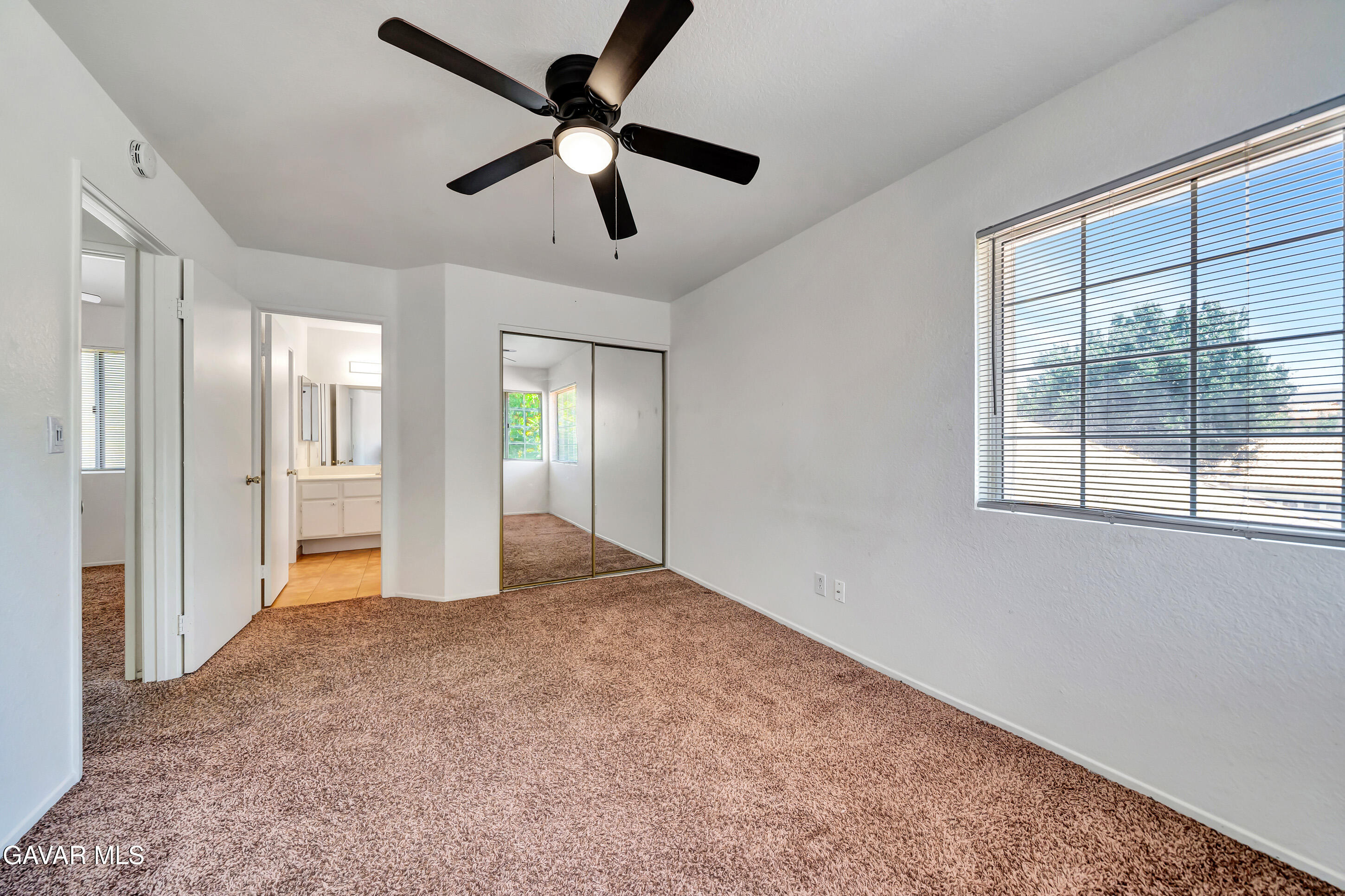 3115 Crowne Drive Palmdale, CA 93551 - Photo 51 of 51 an empty room with fan and windows