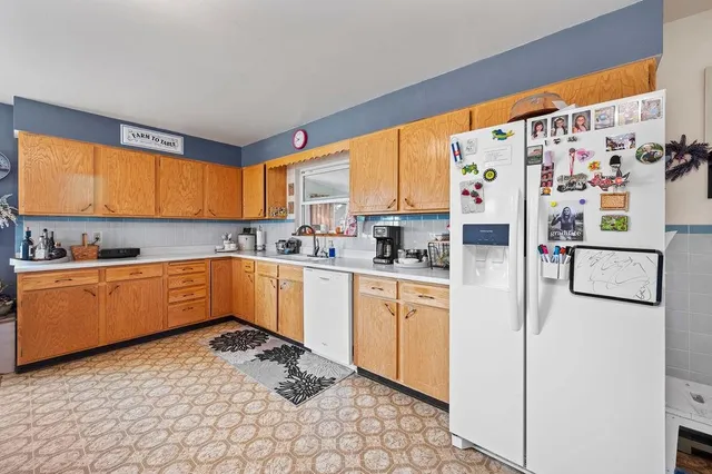 a bedroom with furniture and a flat screen tv