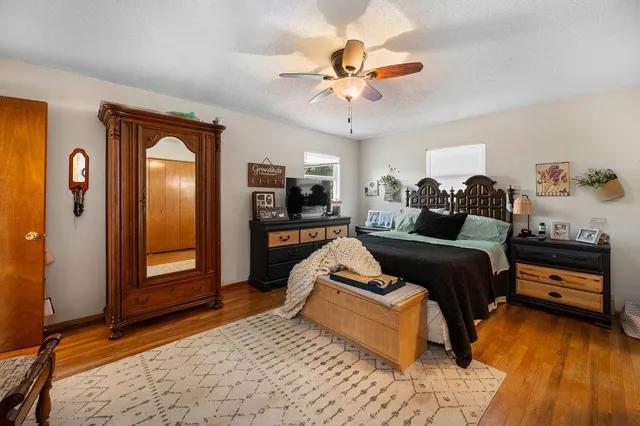 a bathroom with a toilet a sink and a mirror