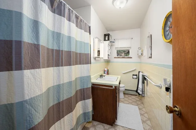 a bed room with a bed and a window