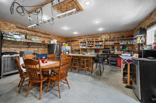 a kitchen with stainless steel appliances granite countertop a stove and a refrigerator