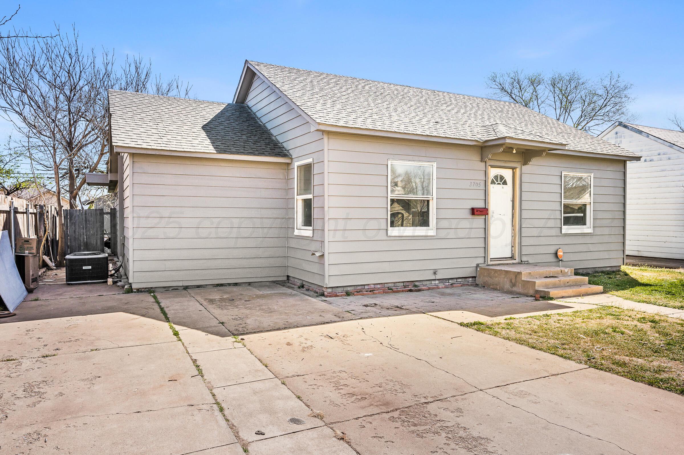 3705 South Polk Street Amarillo, TX 79110 - Photo 2 of 16 a view of a house with a yard and sitting area