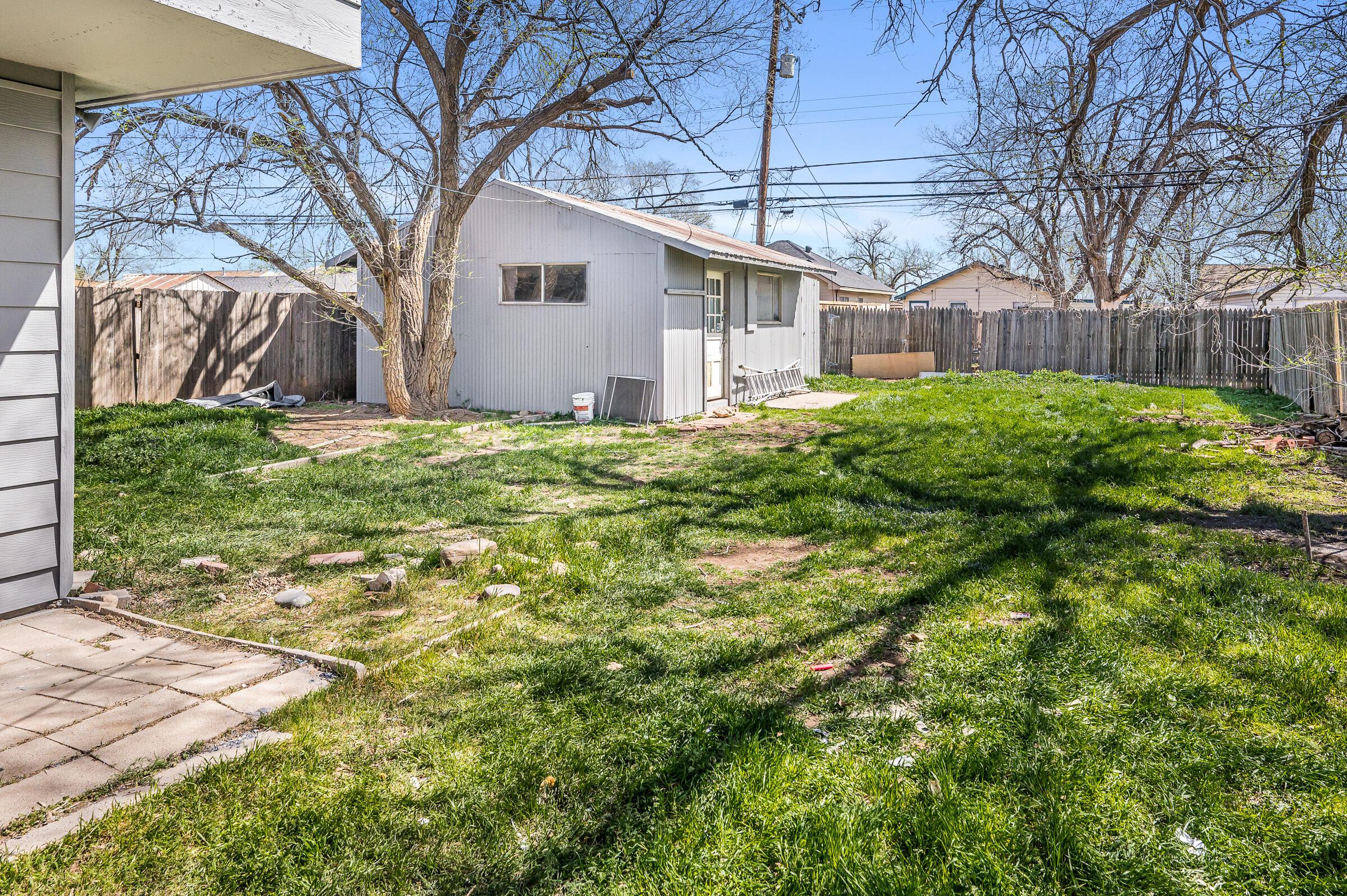 3705 South Polk Street Amarillo, TX 79110 - Photo 4 of 16 a view of a house with a yard