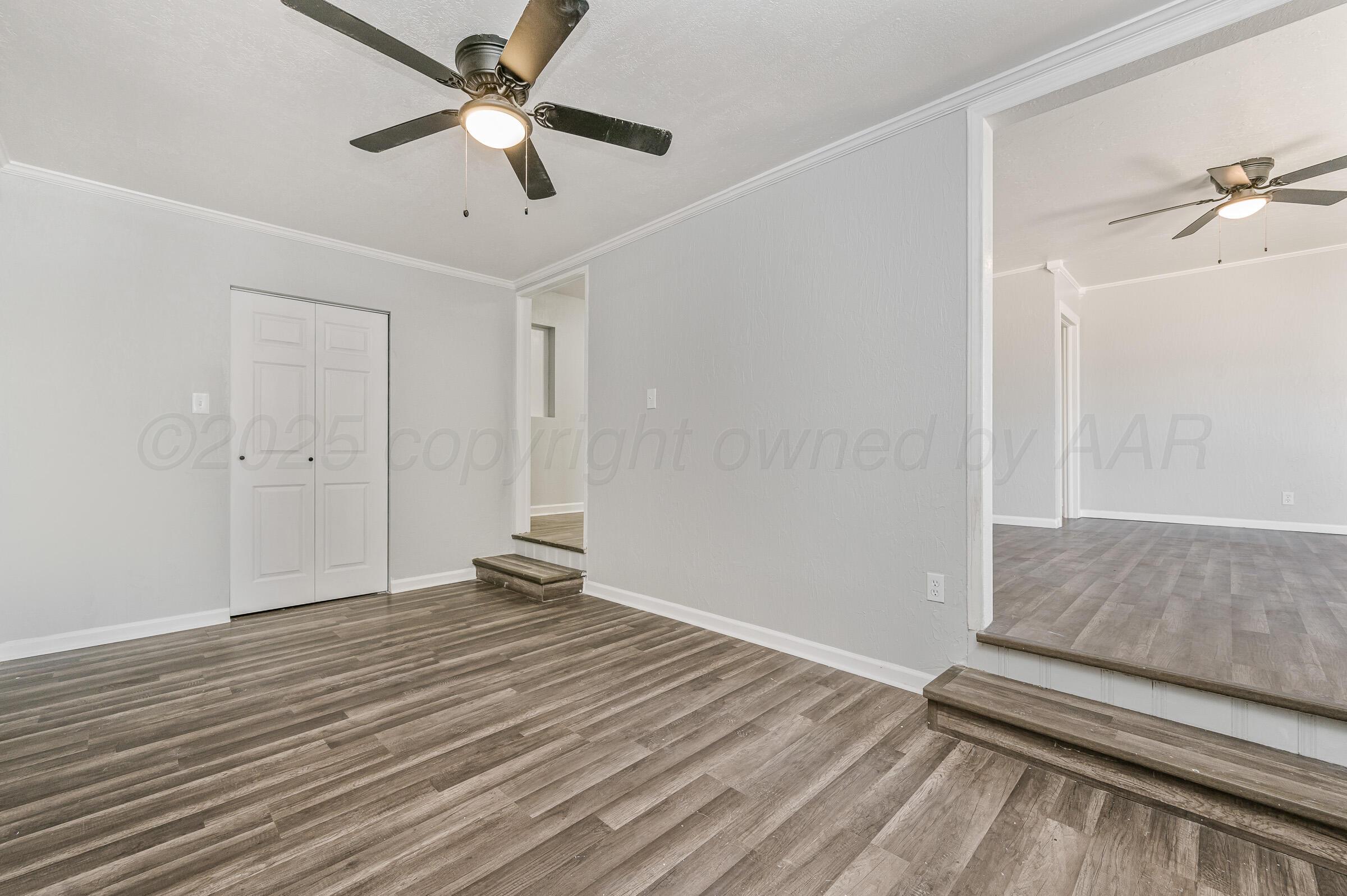 3705 South Polk Street Amarillo, TX 79110 - Photo 9 of 16 wooden floor in an empty room