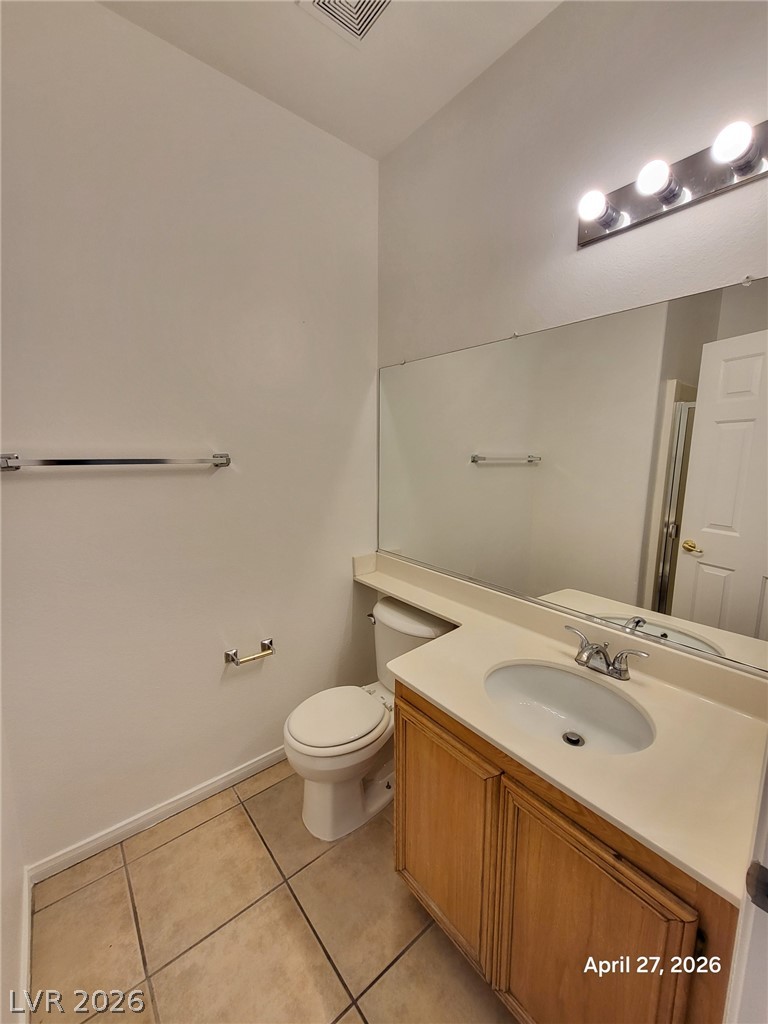4548 Flaming Ridge Trail Las Vegas, NV 89147 - Photo 6 of 21 Tiled flooring and a spacious vanity complete this functional guest bathroom.