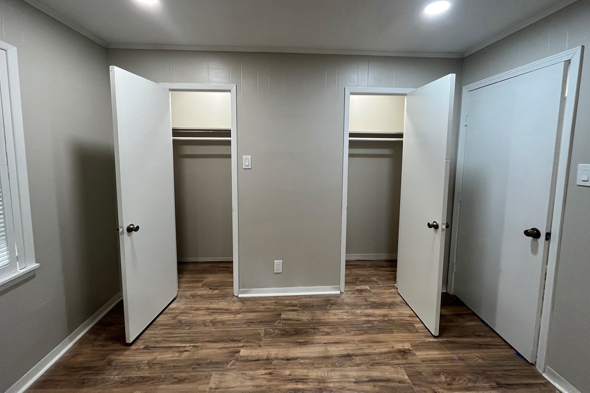 1409 20th Street Huntsville, TX 77340 - Photo 5 of 9 a view of an empty room with closet and wooden floor