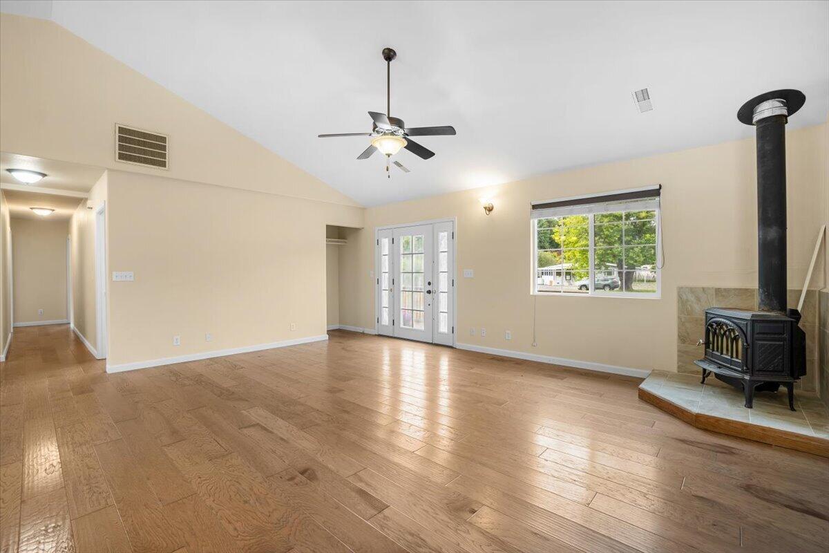 1196 Freshwater Road Eureka, CA 95503 - Photo 15 of 34 a view of an empty room with a window and wooden floor