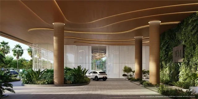 a view of a building with a window and potted plants
