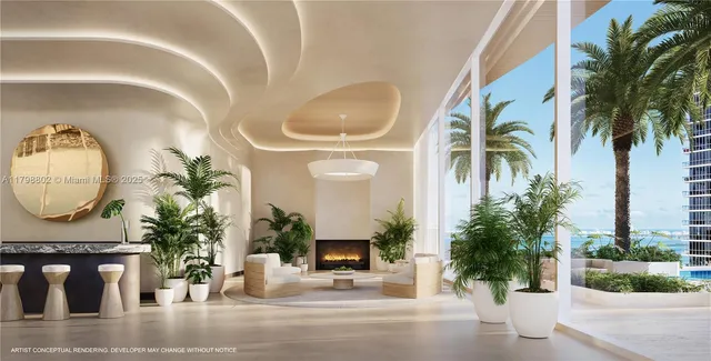 a living room with a potted plant a fireplace and a potted plant