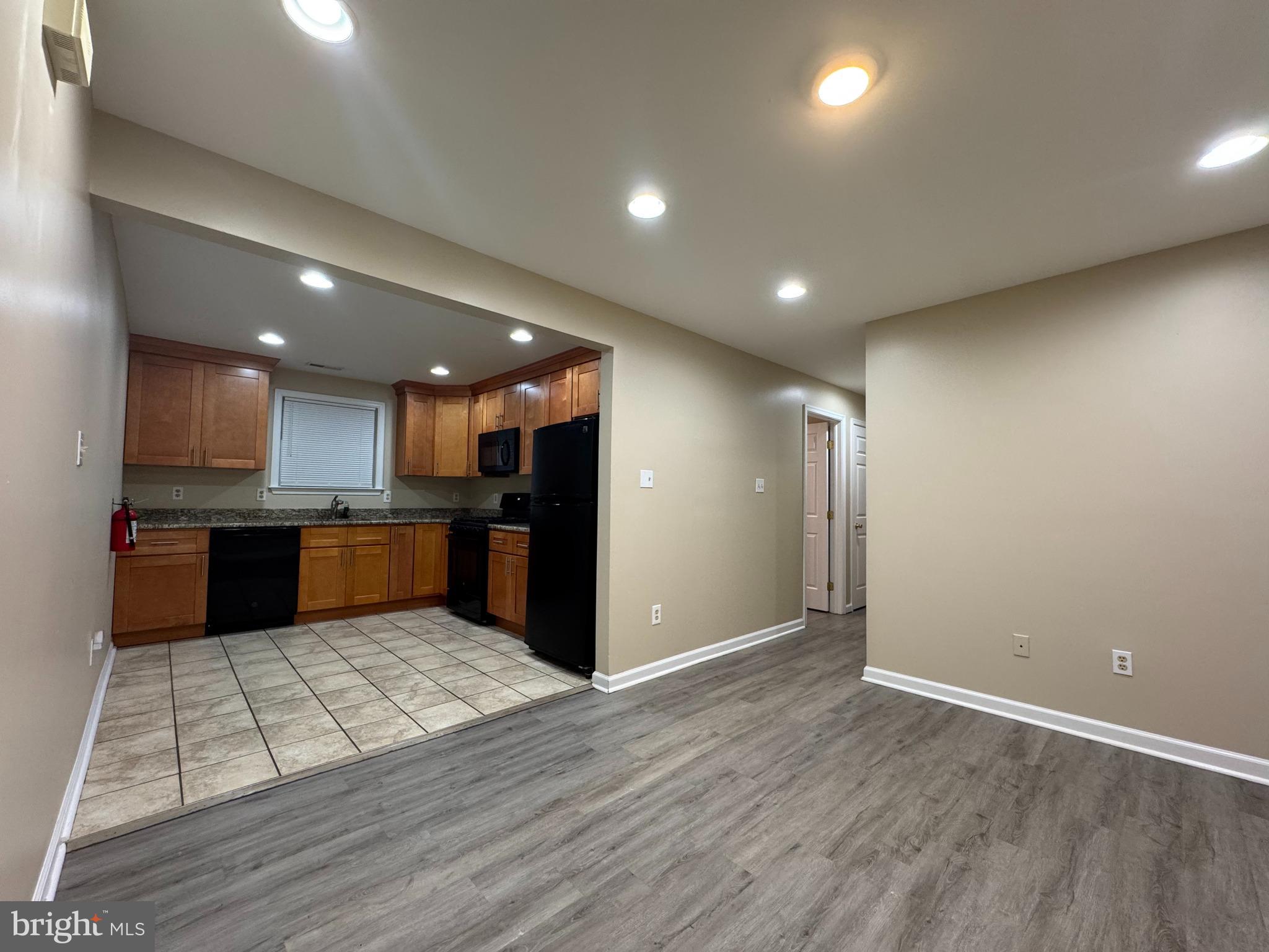 522 A Merchant Street, Unit A Cherry Hill, NJ 08002 - Photo 1 of 24 a view of kitchen with kitchen island microwave and refrigerator