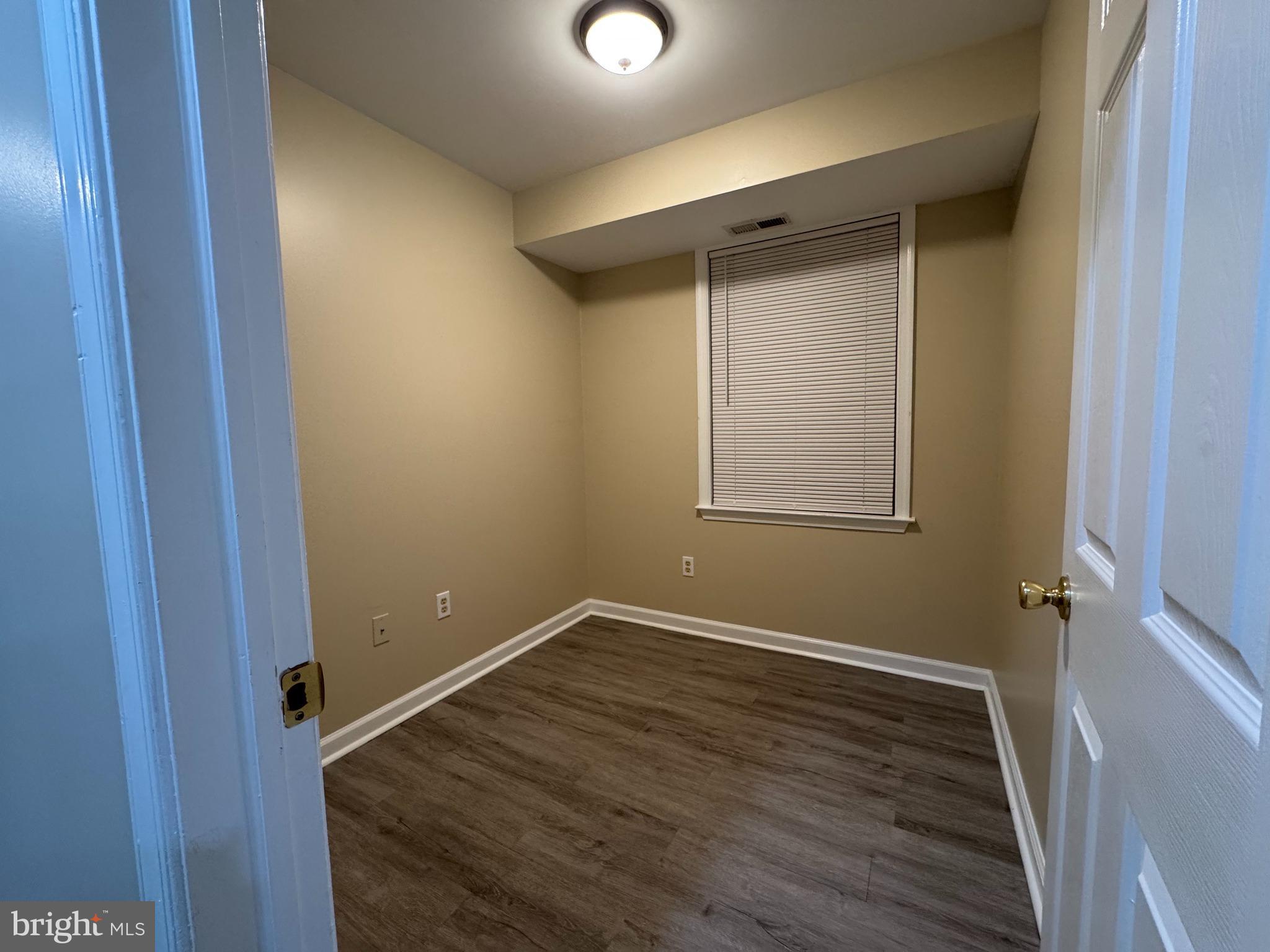 522 A Merchant Street, Unit A Cherry Hill, NJ 08002 - Photo 12 of 24 a view of a small space with wooden floor and a window