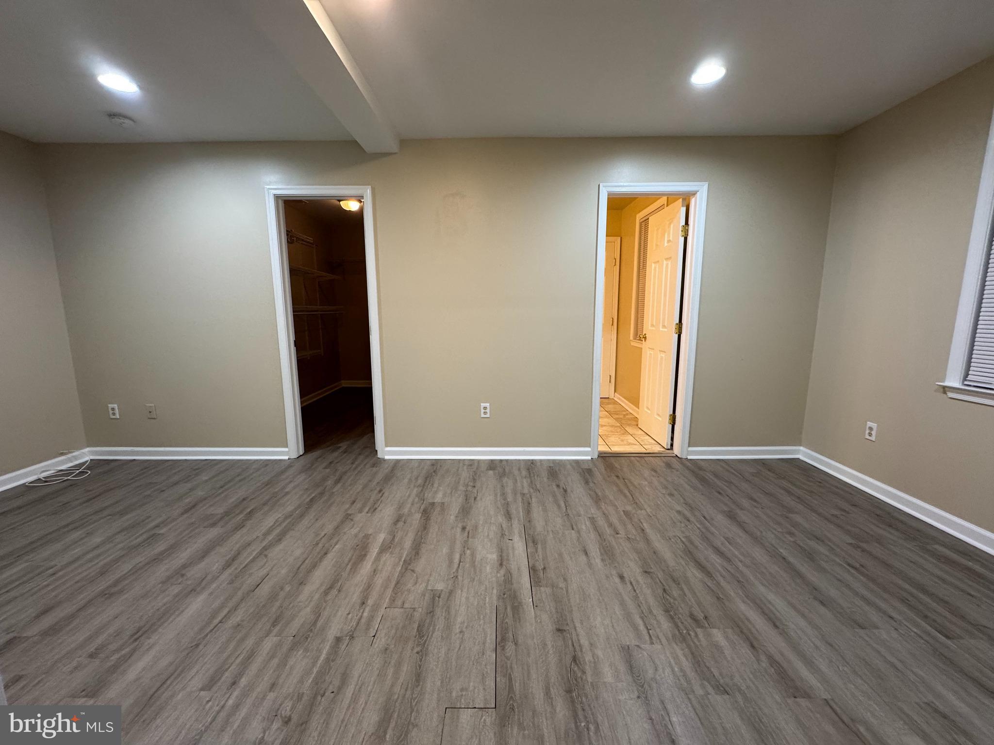 522 A Merchant Street, Unit A Cherry Hill, NJ 08002 - Photo 13 of 24 an empty room with wooden floor and windows