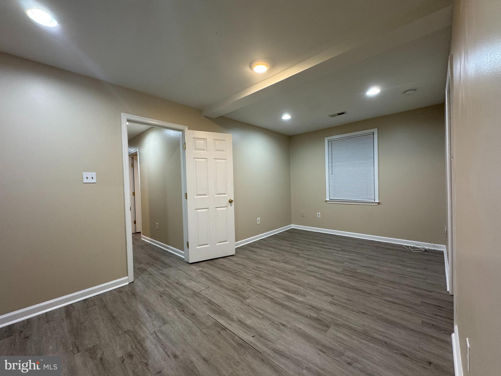 522 A Merchant Street, Unit A Cherry Hill, NJ 08002 - Photo 15 of 24 an empty room with wooden floor and windows