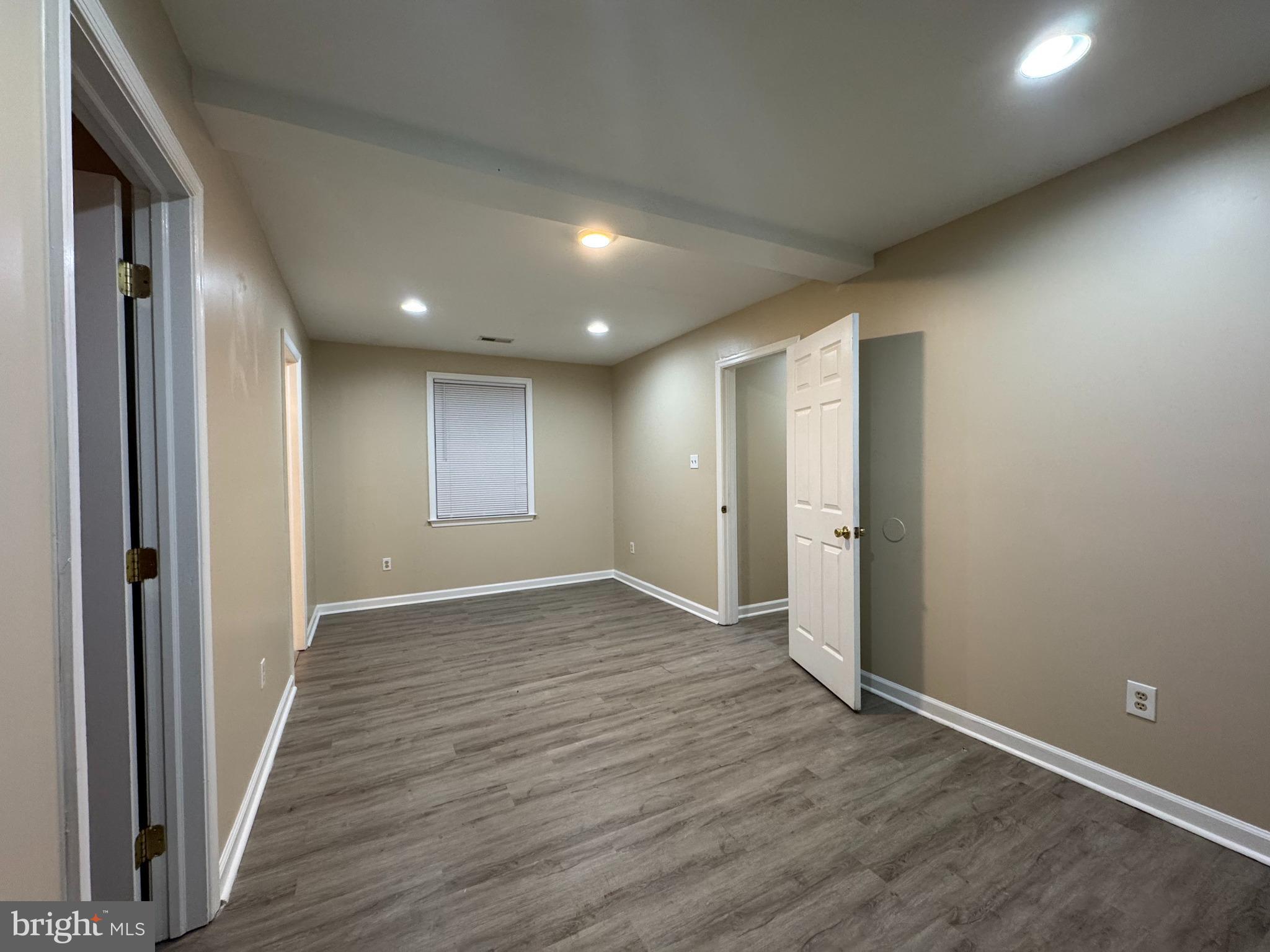 522 A Merchant Street, Unit A Cherry Hill, NJ 08002 - Photo 18 of 24 an empty room with wooden floor and windows