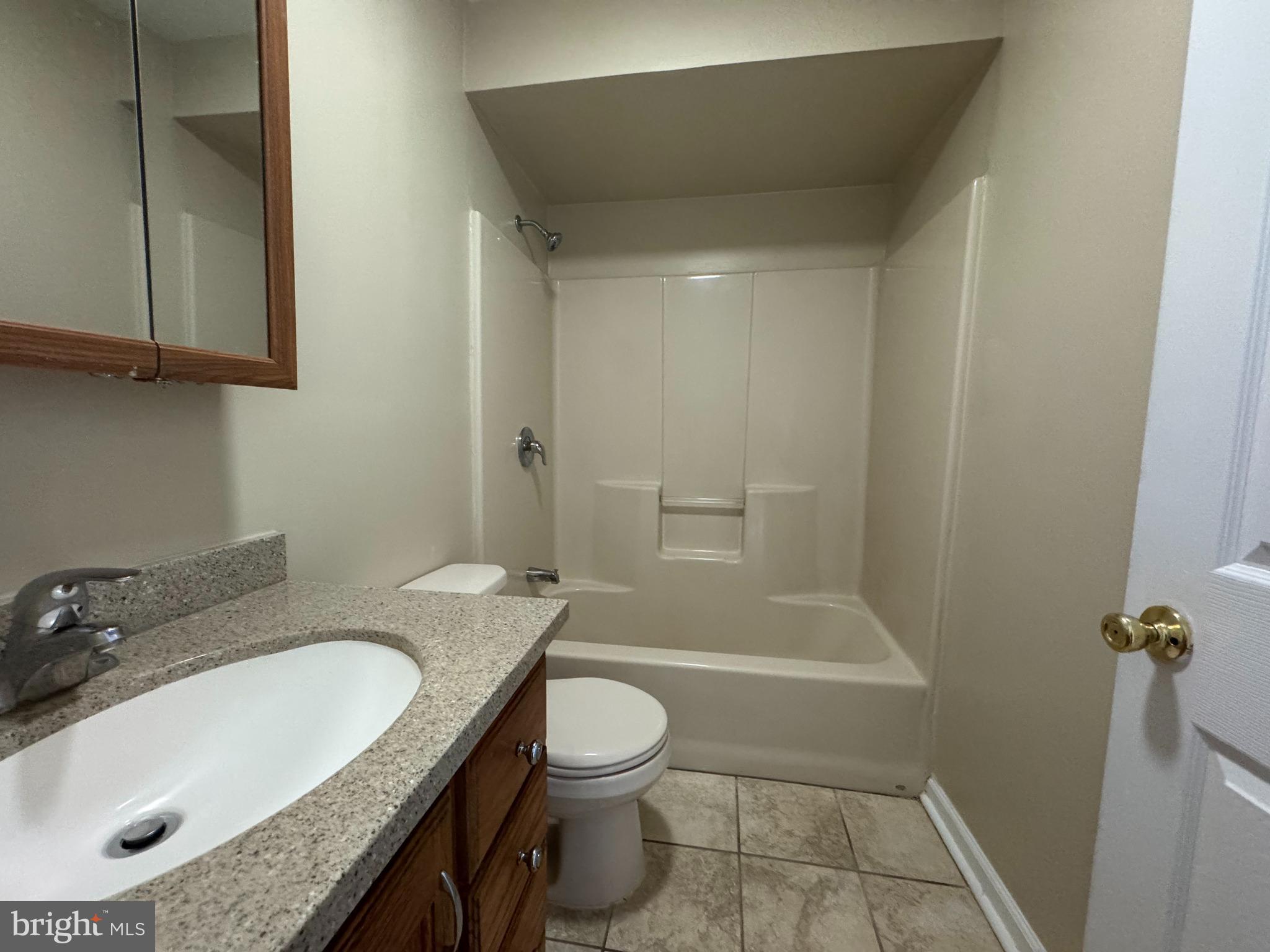 522 A Merchant Street, Unit A Cherry Hill, NJ 08002 - Photo 6 of 24 a bathroom with a granite countertop sink toilet and shower