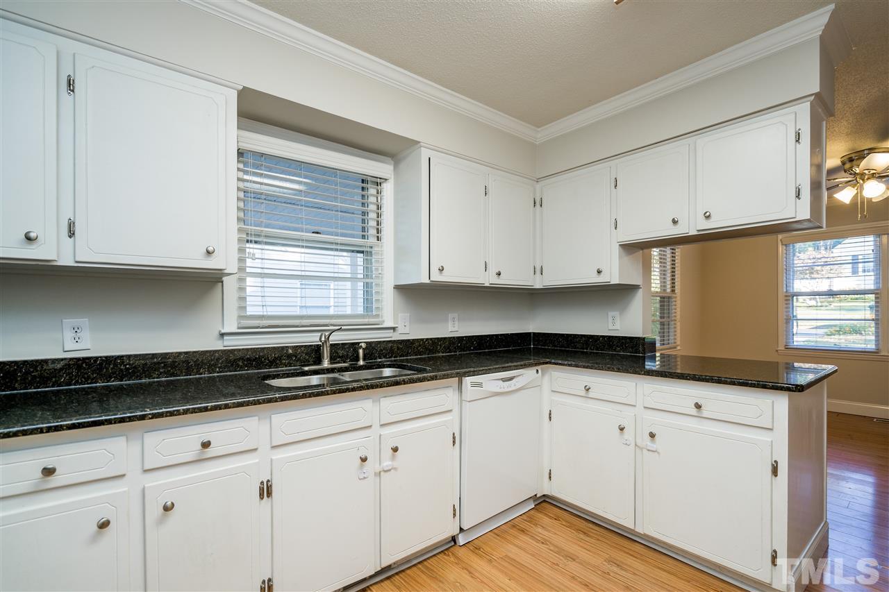714 New Road Raleigh, NC 27608 - Photo 14 of 25 Timeless granite is easy for meal prep and easy cleaning!