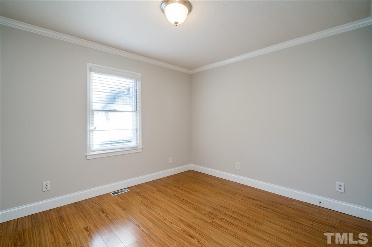 714 New Road Raleigh, NC 27608 - Photo 16 of 25 Natural light shines into these bedrooms with gleaming walls and floors!