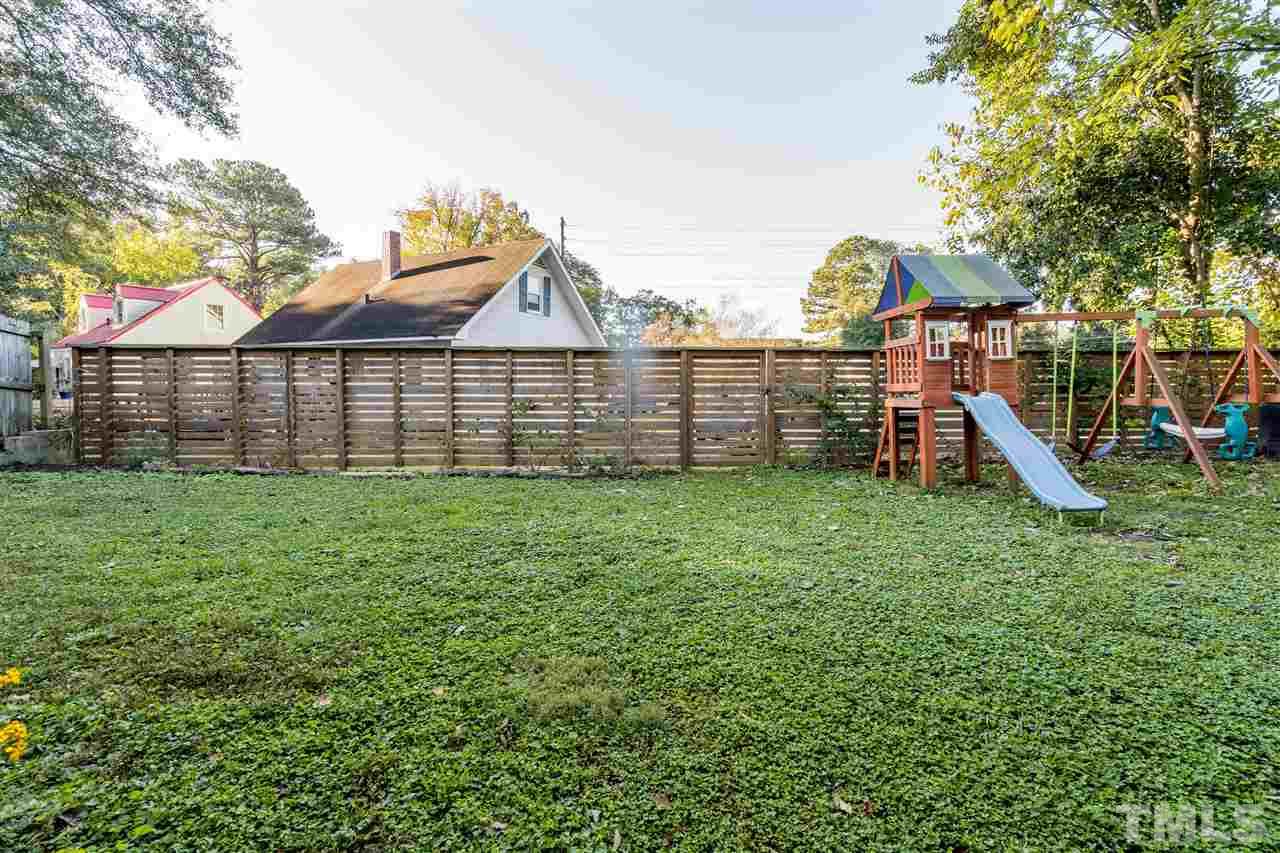 714 New Road Raleigh, NC 27608 - Photo 24 of 25 Flat, grassy backyard that is fenced with unlimited garden potential!