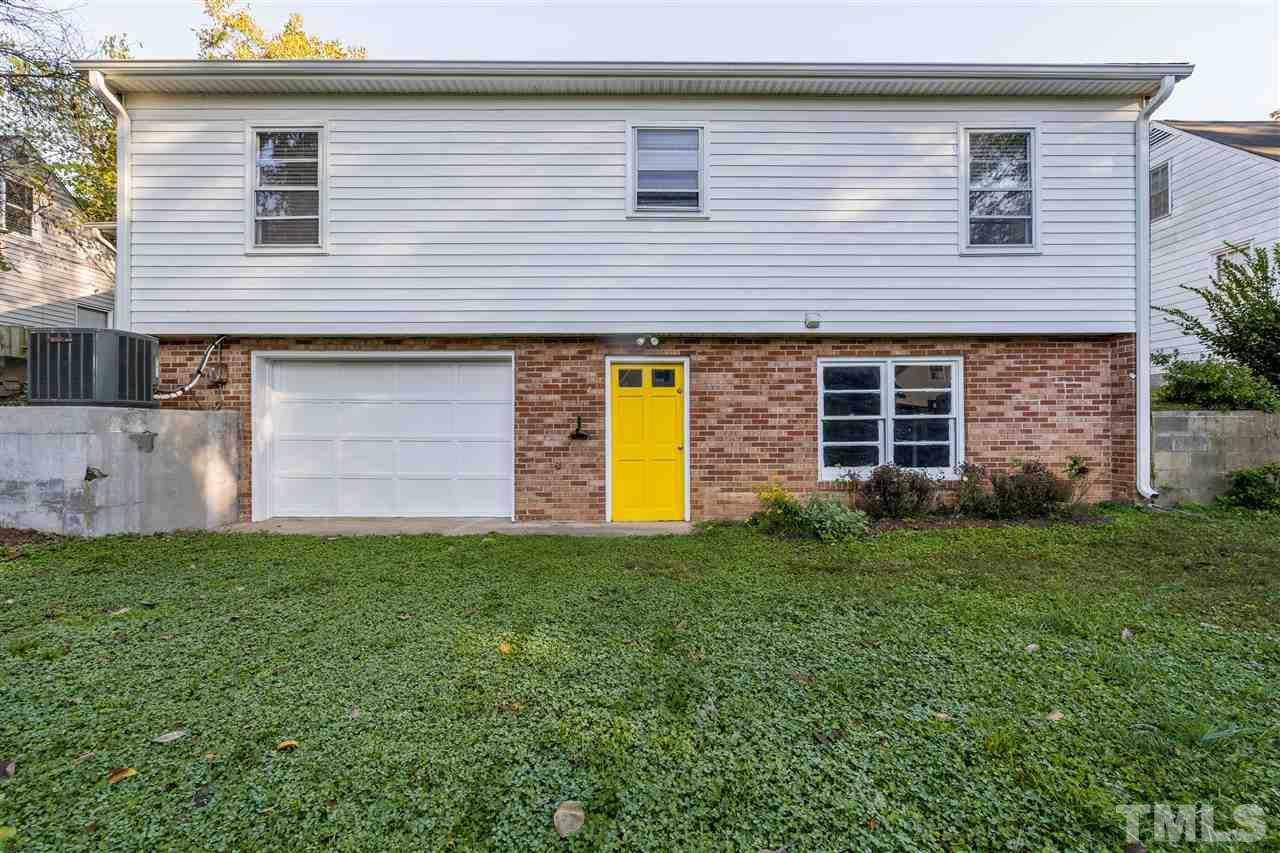 714 New Road Raleigh, NC 27608 - Photo 25 of 25 Garage door opens to basement for a large space to play and bring the indoors outdoors!
