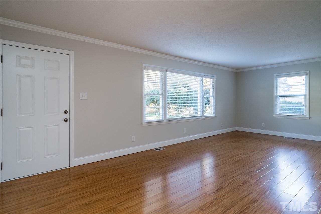 714 New Road Raleigh, NC 27608 - Photo 5 of 25 Cozy front living room greets you and friends upon entering the home.