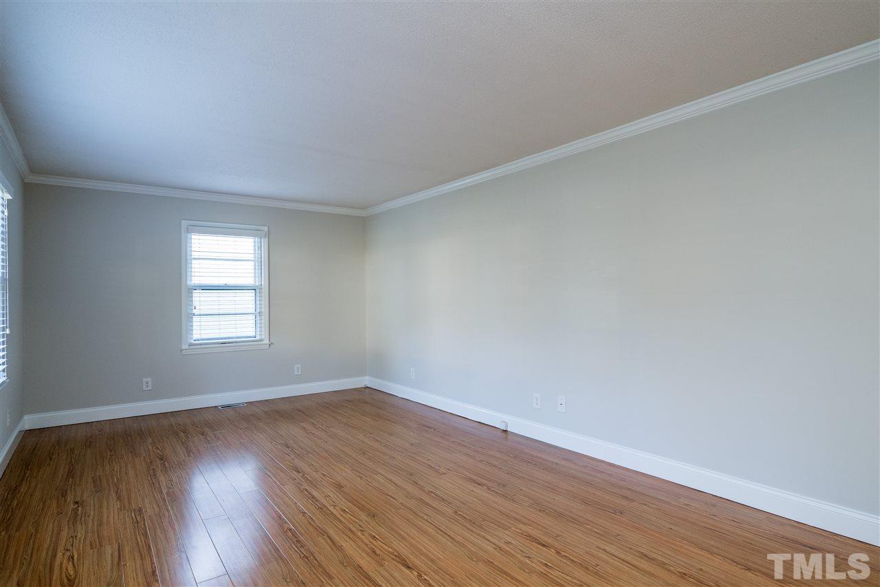 714 New Road Raleigh, NC 27608 - Photo 6 of 25 Large living room could be multi-purpose with a living room and home office combo.