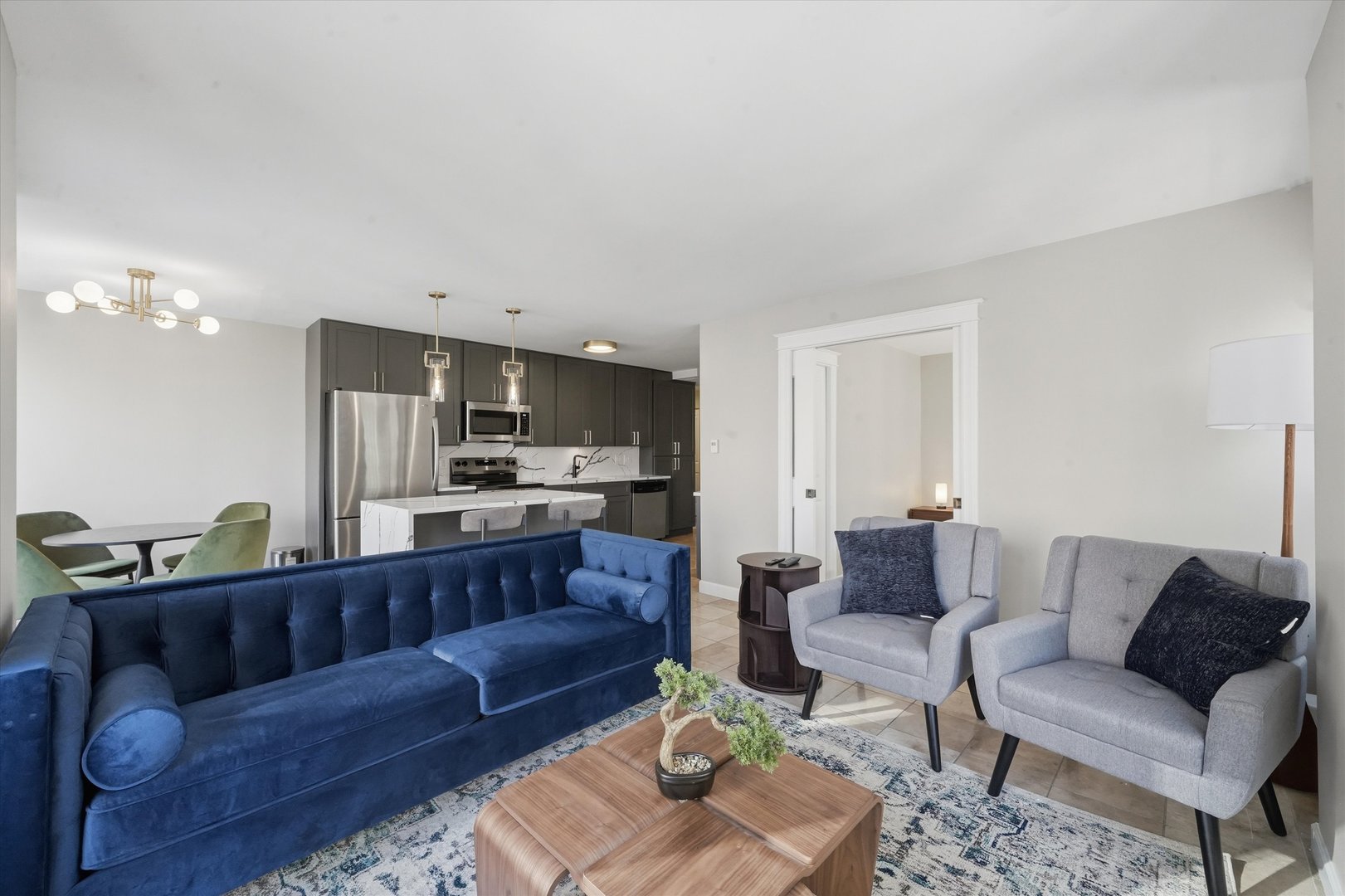 30 East Huron Street, Unit 907 Chicago, IL 60611 - Photo 4 of 13 a living room with furniture and kitchen view