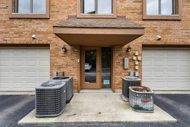 a front view of a house with outdoor seating