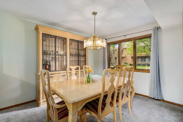 a dining room with furniture window wooden floor