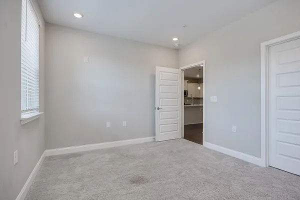 a view of an empty room with a closet