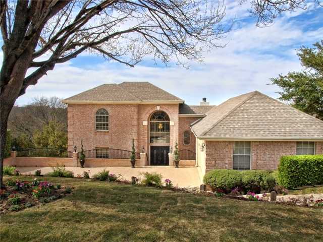 3400 Riva Ridge Road Austin, TX 78746 - Photo 1 of 1 a front view of a house with a garden