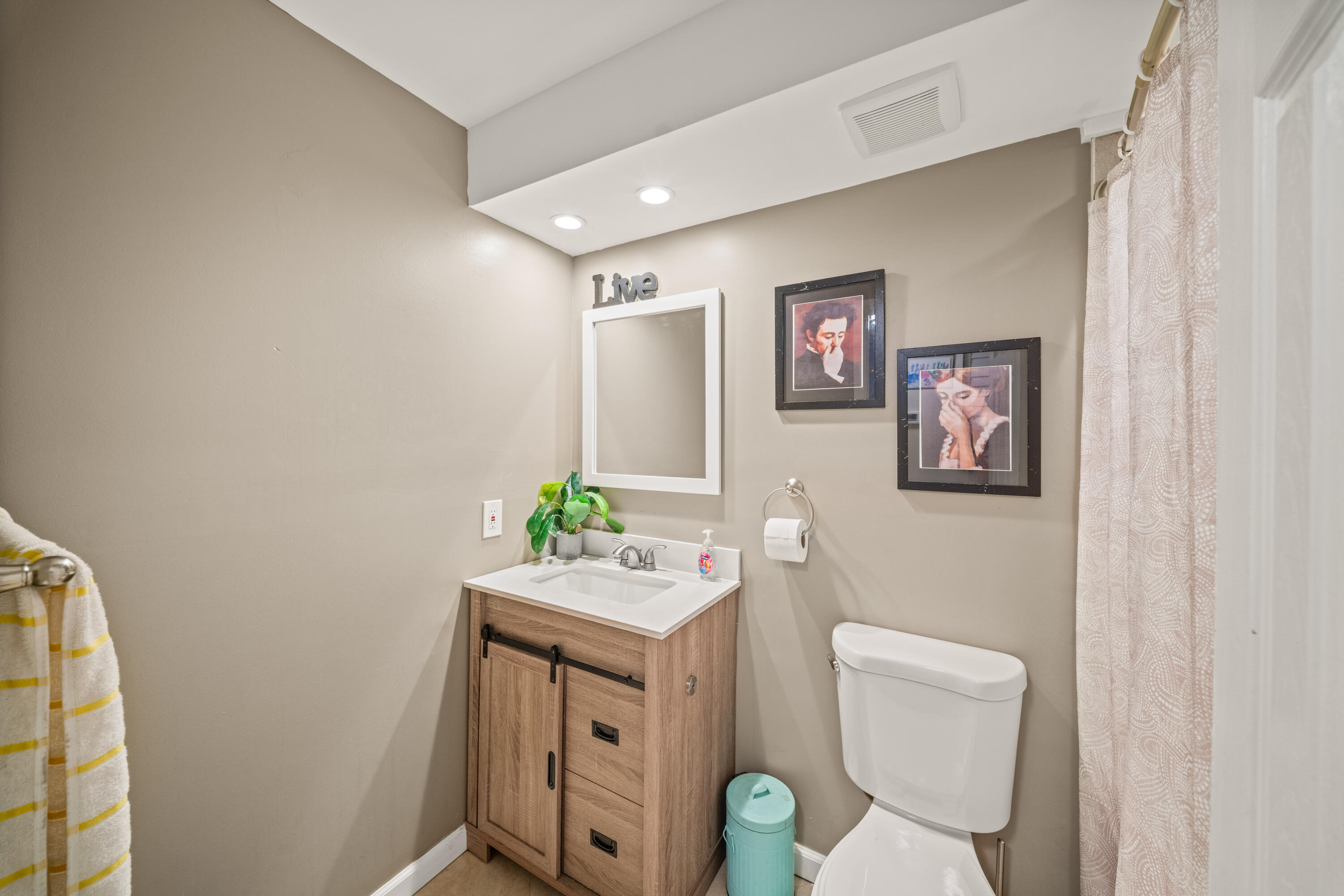 4528 Southwest 54th Street, Unit 302B Dania Beach, FL 33314 - Photo 20 of 33 a bathroom with a granite countertop sink mirror vanity and toilet