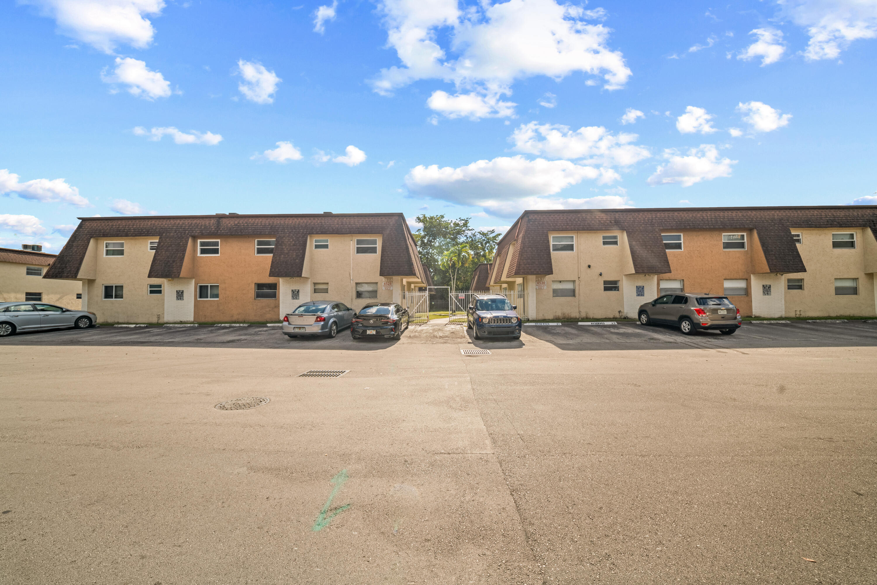 4528 Southwest 54th Street, Unit 302B Dania Beach, FL 33314 - Photo 32 of 33 a view of a car parked in the patio
