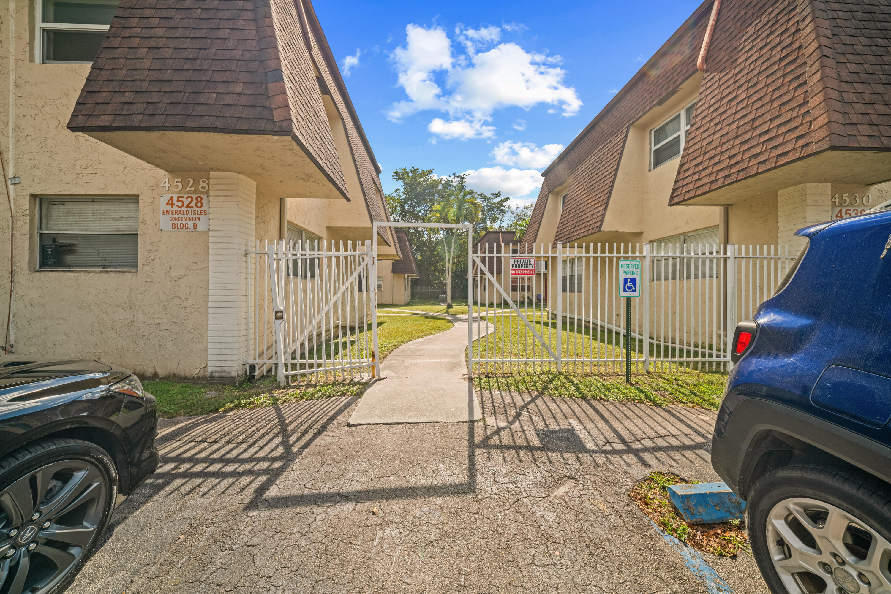 4528 Southwest 54th Street, Unit 302B Dania Beach, FL 33314 - Photo 33 of 33 a view of a house with a backyard and a tv