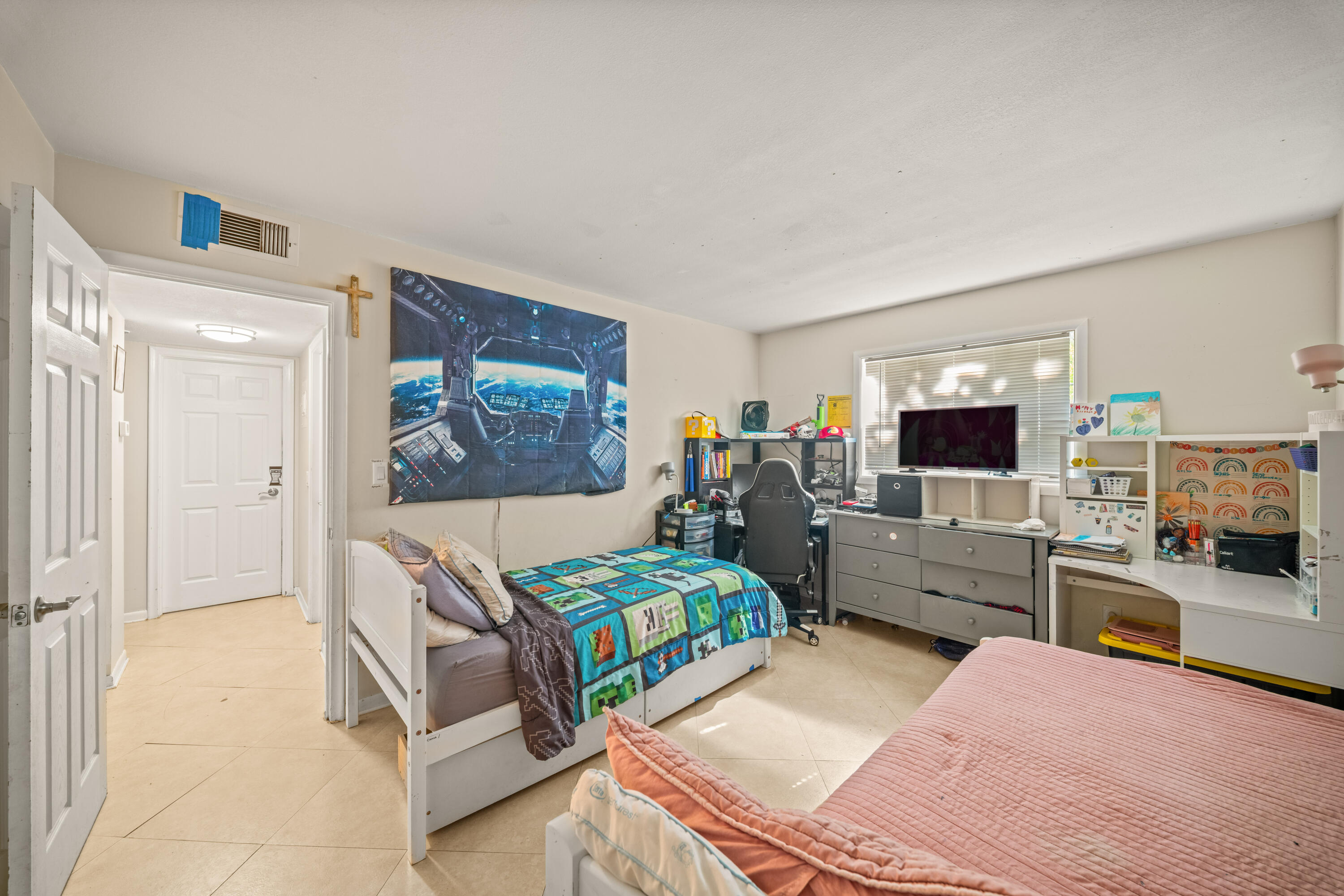 4528 Southwest 54th Street, Unit 302B Dania Beach, FL 33314 - Photo 7 of 33 a bedroom with a bed and furniture