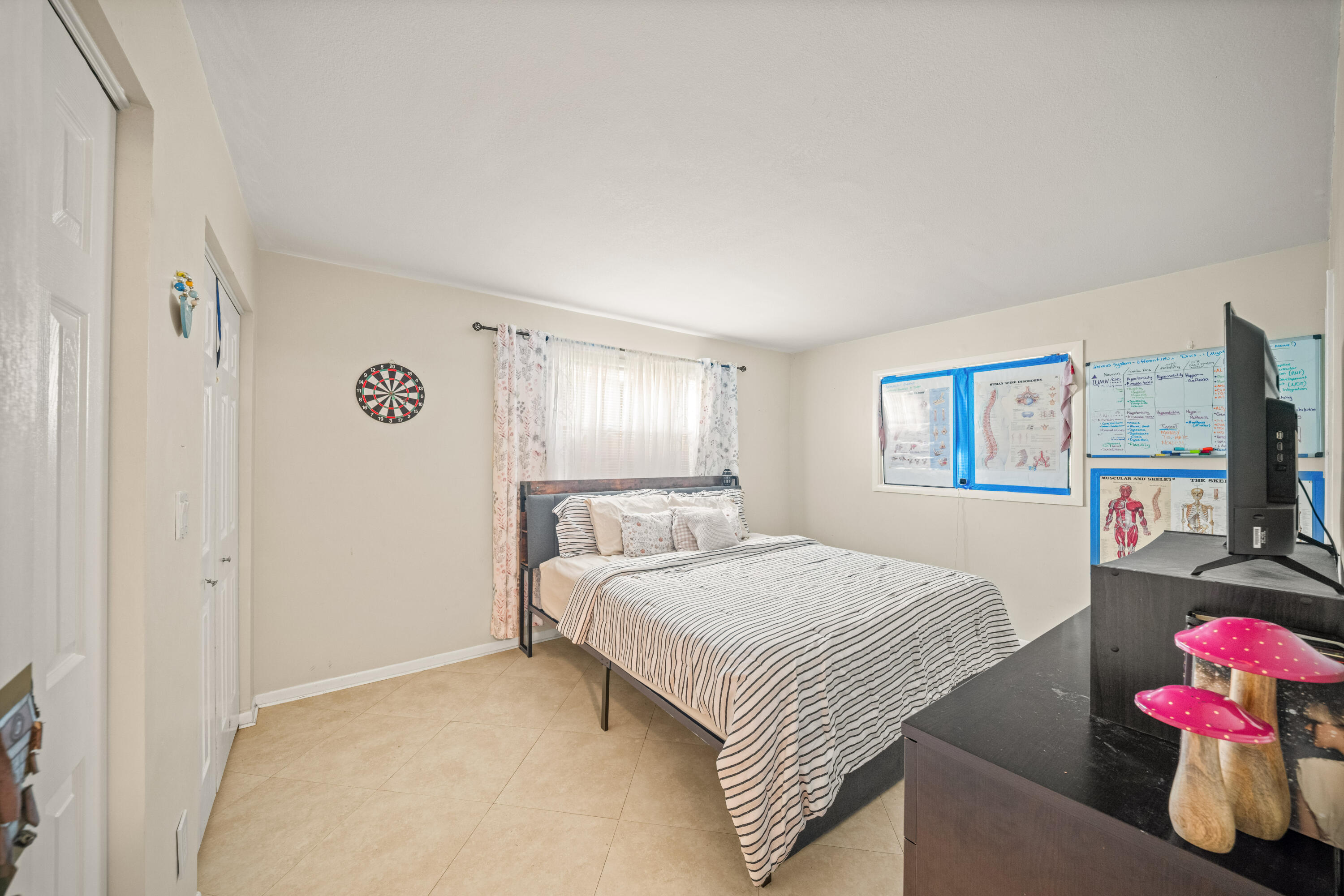 4528 Southwest 54th Street, Unit 302B Dania Beach, FL 33314 - Photo 9 of 33 a bedroom with a bed and a window