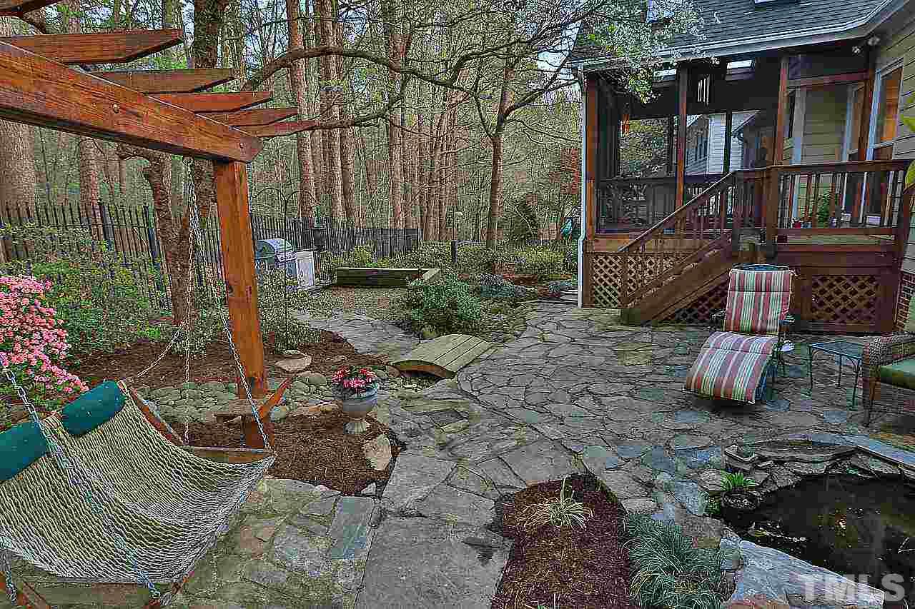 8536 Yucca Trail Raleigh, NC 27615 - Photo 17 of 23 a view of a chair and table in backyard
