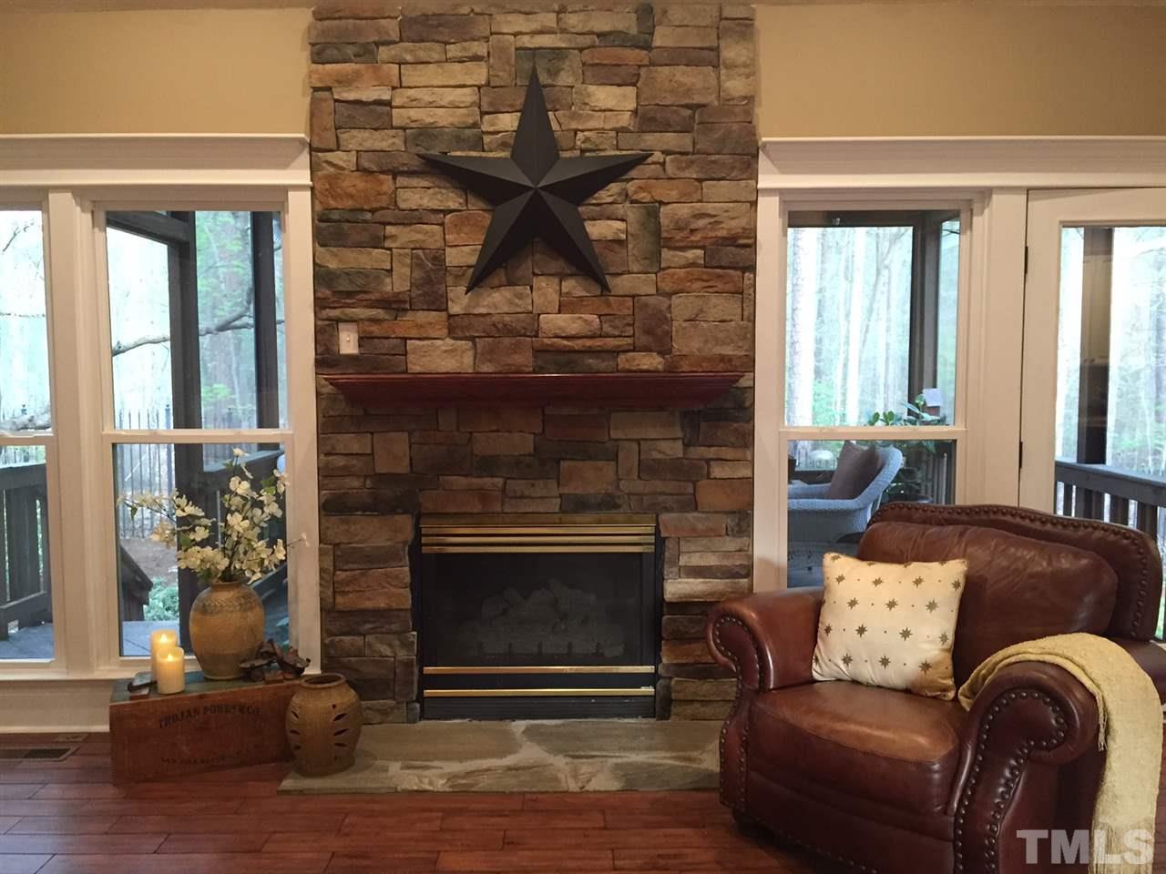 8536 Yucca Trail Raleigh, NC 27615 - Photo 3 of 23 a living room with furniture and a fireplace