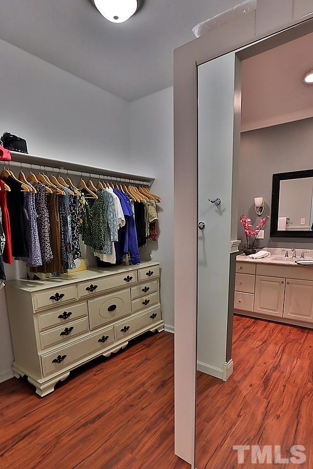 8536 Yucca Trail Raleigh, NC 27615 - Photo 7 of 23 a view of walk in closet with clothes and shoes