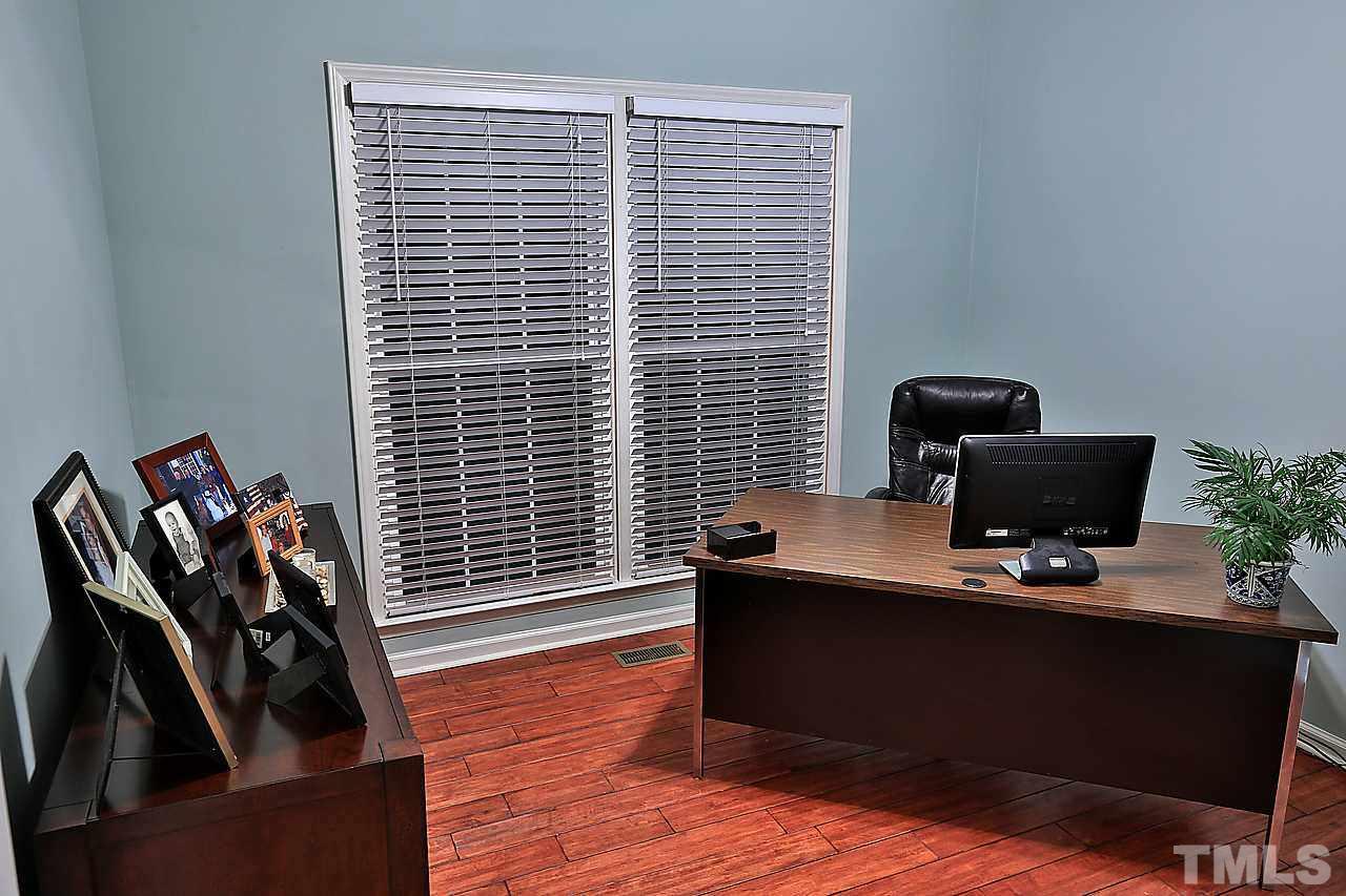 8536 Yucca Trail Raleigh, NC 27615 - Photo 9 of 23 a view of a workspace with furniture and a window