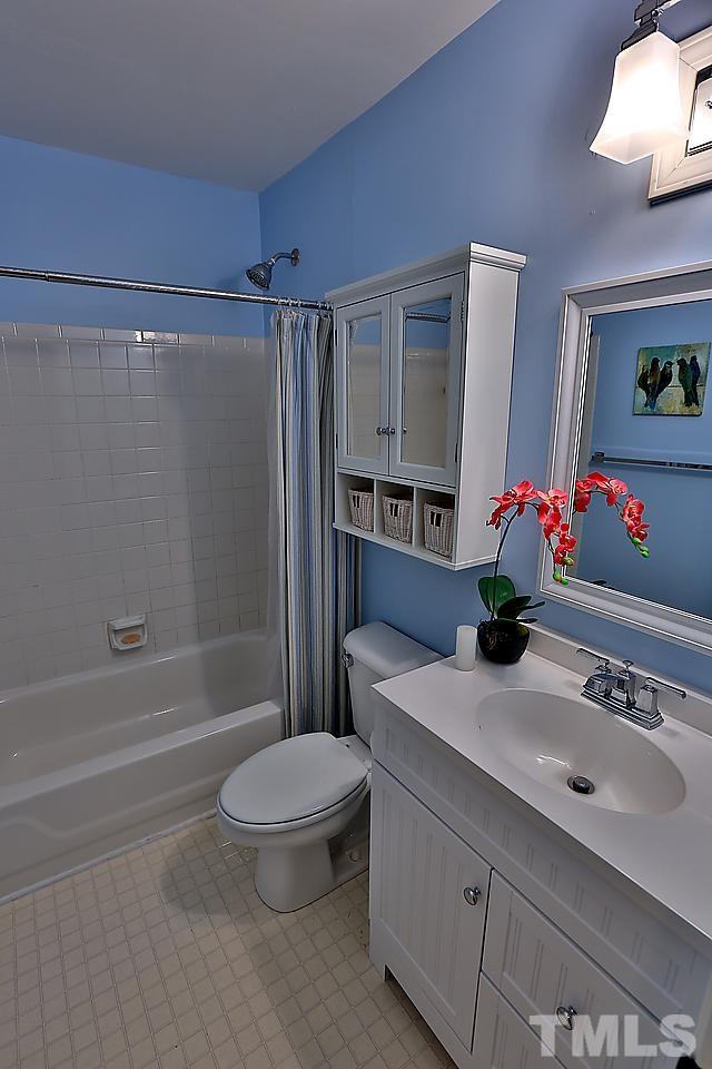 8536 Yucca Trail Raleigh, NC 27615 - Photo 10 of 23 a bathroom with a sink toilet and shower