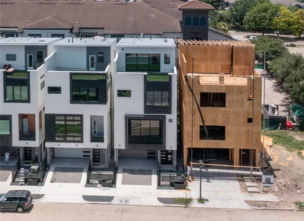 a front view of a building with parking
