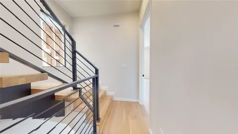 a view of a livingroom with a ceiling fan and window