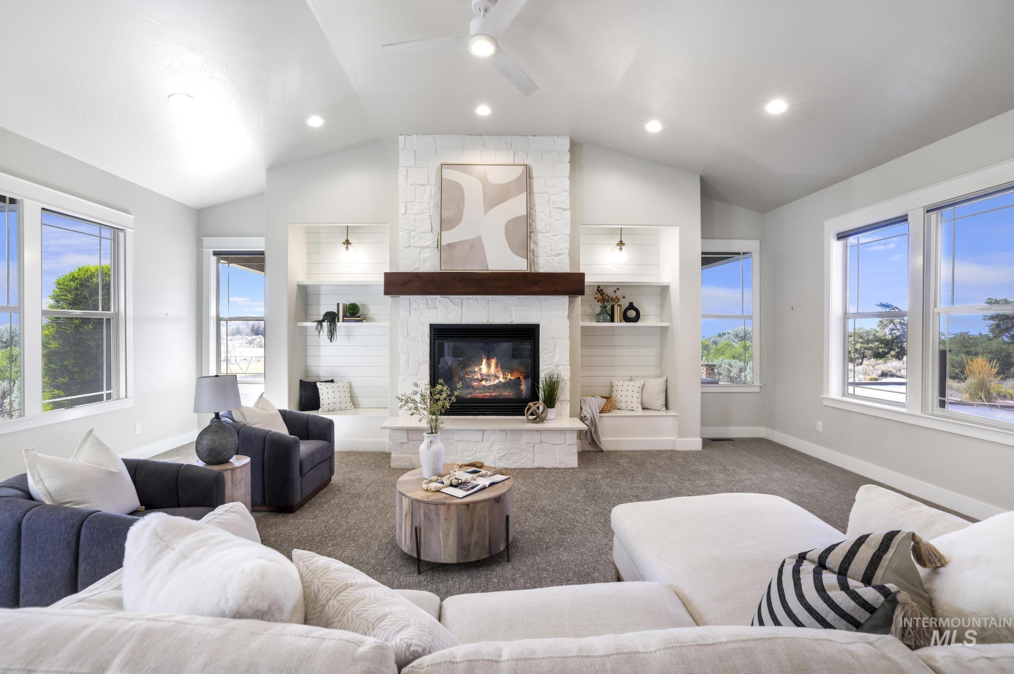 3365 Willow Way Twin Falls, ID 83301 - Photo 16 of 50 Living area featuring ceiling fan, a stone fireplace, carpet floors, recessed lighting, and vaulted ceiling