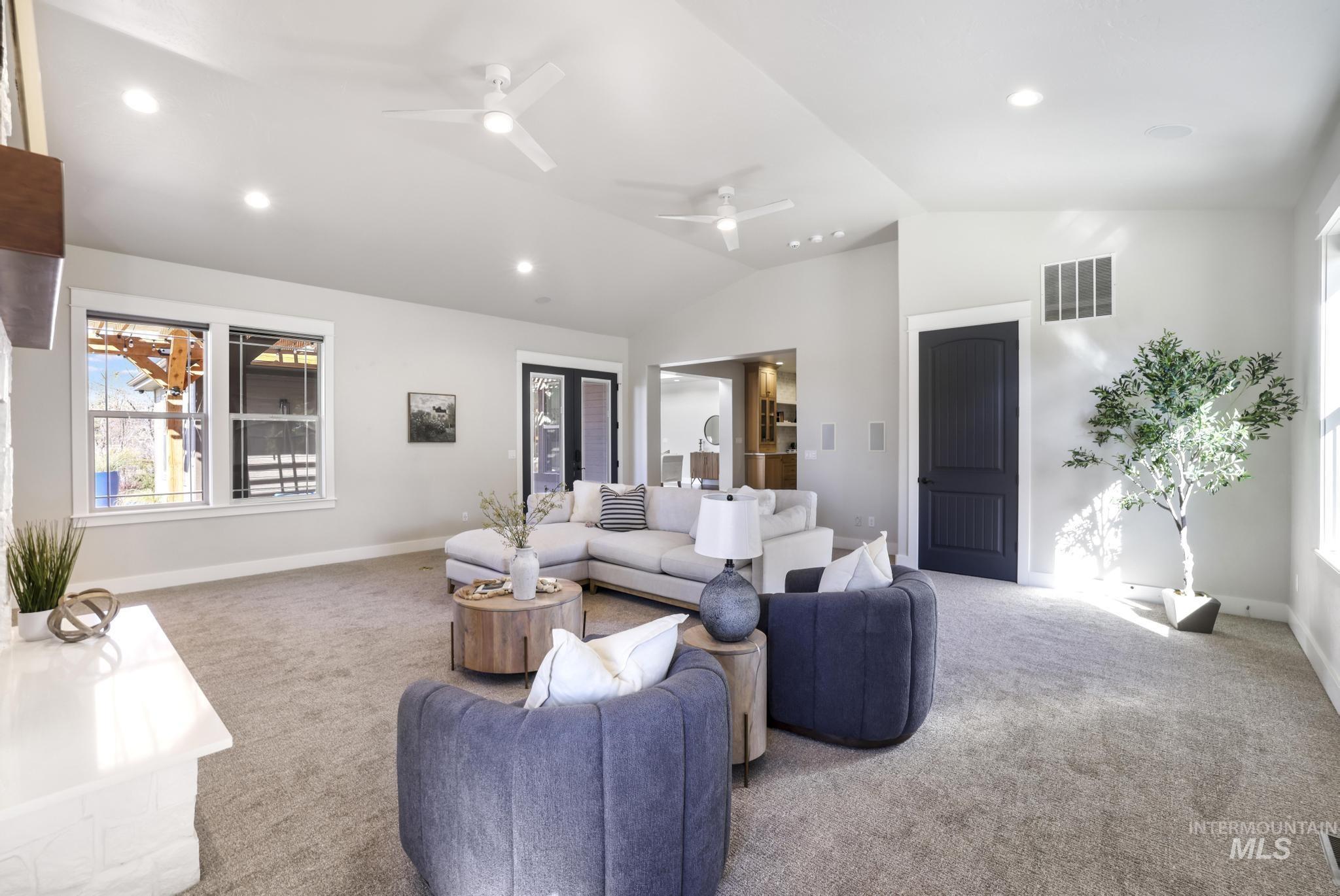 3365 Willow Way Twin Falls, ID 83301 - Photo 17 of 50 Living area with carpet flooring, a ceiling fan, recessed lighting, and vaulted ceiling