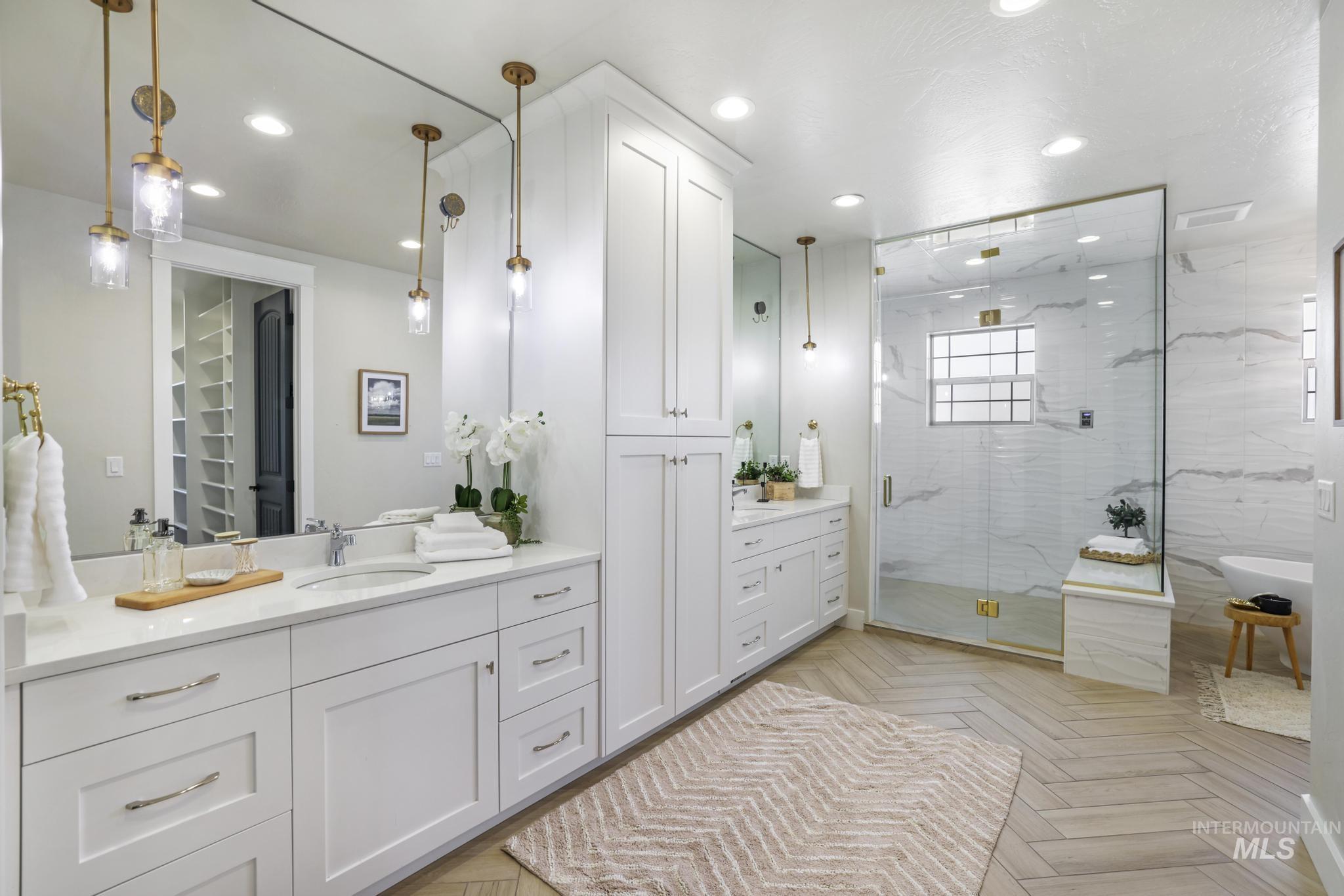 3365 Willow Way Twin Falls, ID 83301 - Photo 19 of 50 Bathroom with vanity, parquet floors, recessed lighting, a marble finish shower, and a freestanding bath
