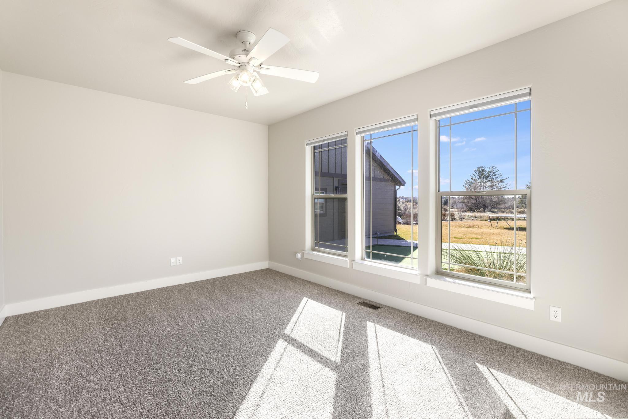 3365 Willow Way Twin Falls, ID 83301 - Photo 22 of 50 Unfurnished room with carpet and ceiling fan