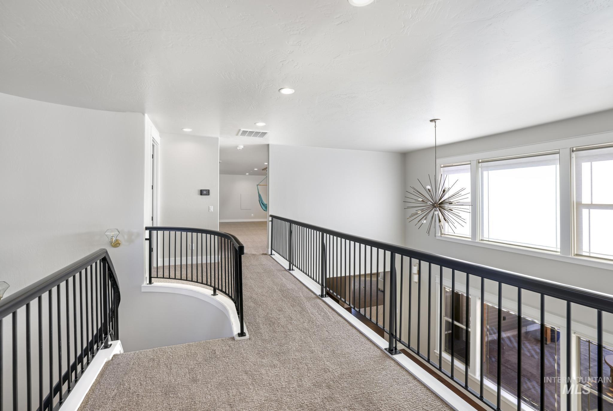 3365 Willow Way Twin Falls, ID 83301 - Photo 25 of 50 Hallway with carpet and a chandelier