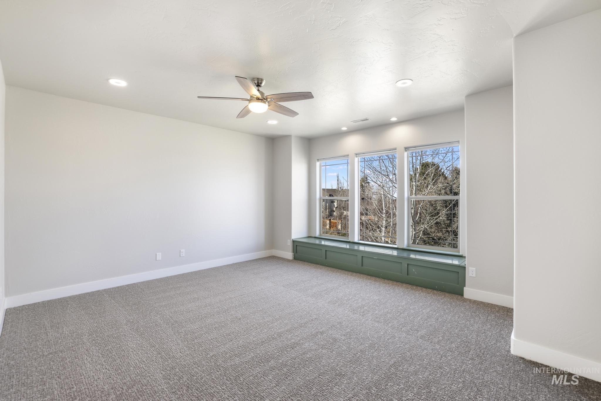 3365 Willow Way Twin Falls, ID 83301 - Photo 27 of 50 Carpeted spare room featuring a ceiling fan and recessed lighting