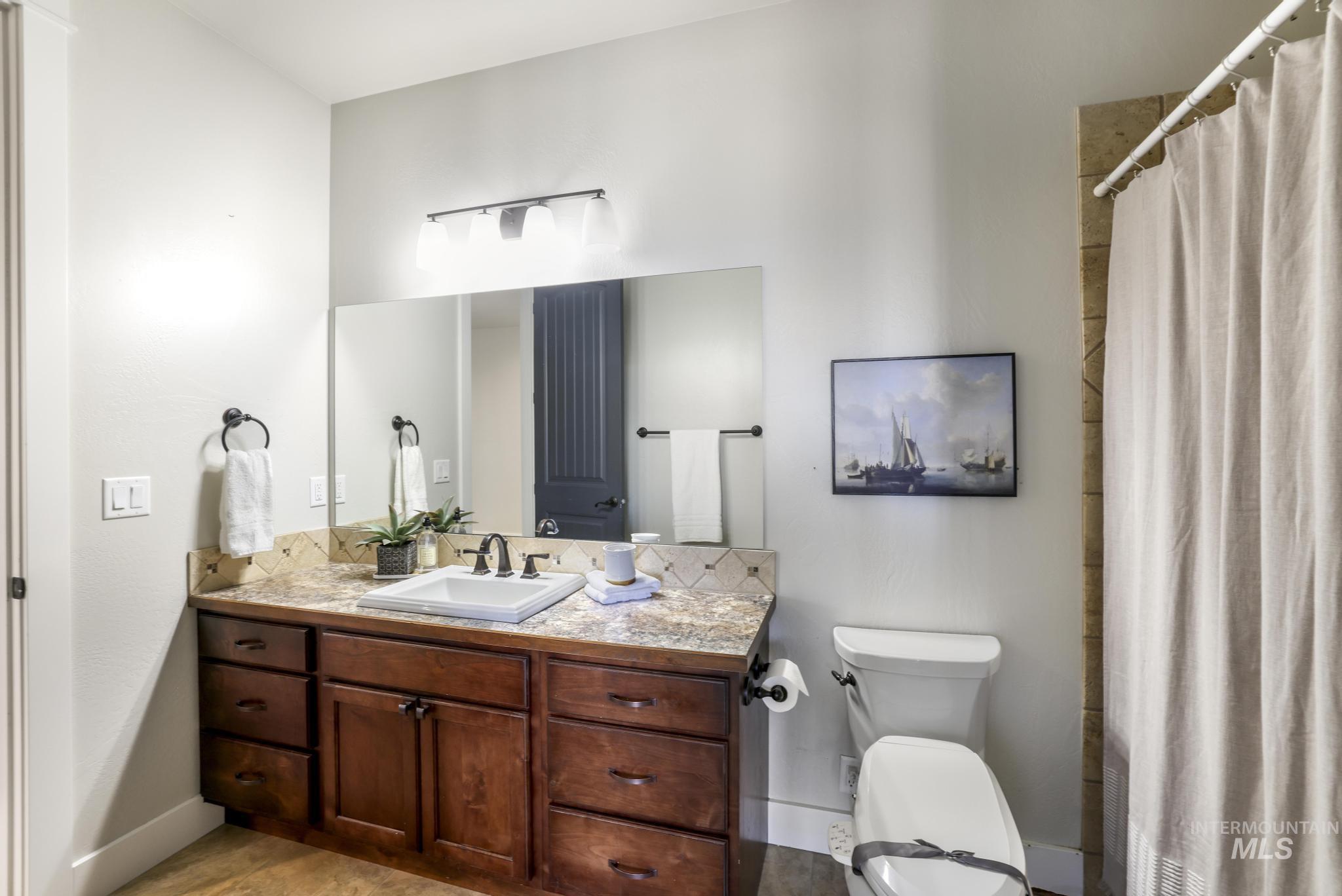 3365 Willow Way Twin Falls, ID 83301 - Photo 32 of 50 Bathroom featuring vanity and a shower with shower curtain